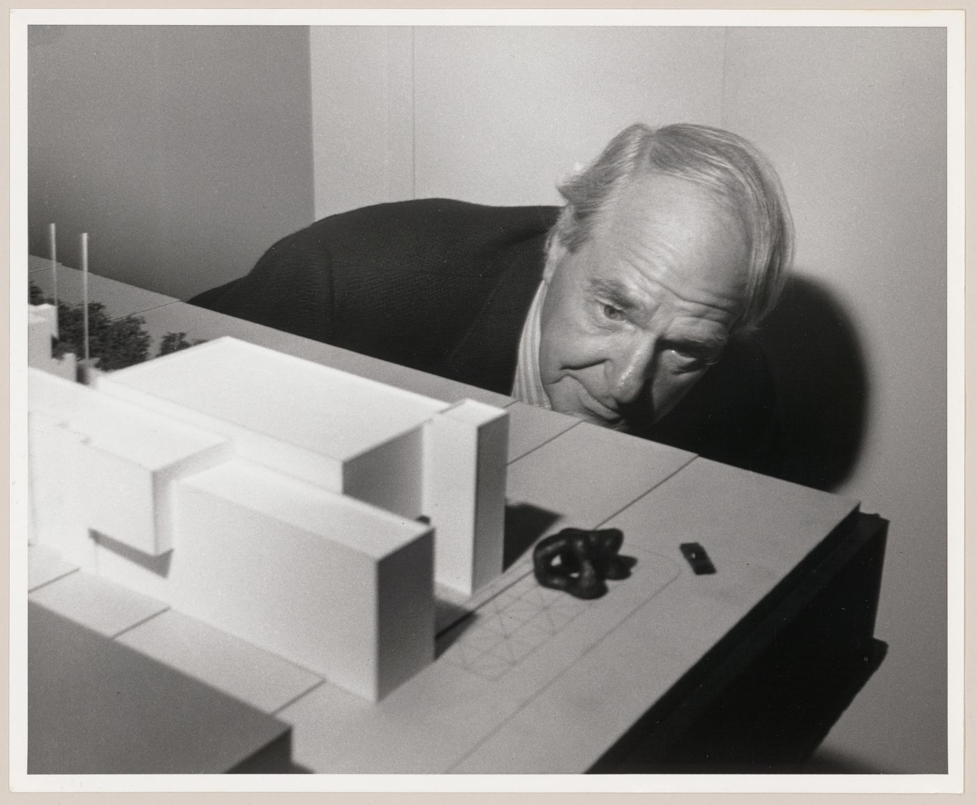 Henry Moore looking at model for Henry Moore Sculpture Centre project for Art Gallery Ontario, Toronto