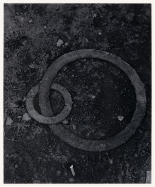 View of interlocking metal rings, a cigarette butt and soil, Berlin, Germany, from the artist book "The Potsdamer Project"