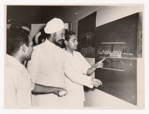 Aditya Prakash with Punjab Chief Minister Partap Singh Kairon, pointing to Edward Durell Stone’s U.S. Embassy in New Delhi at an unidentified exhibition