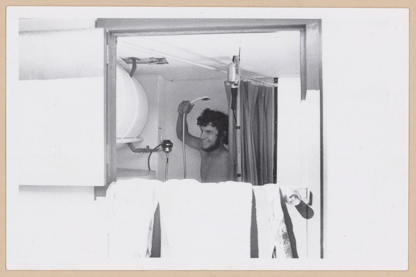Arthur Acheson taking a shower in the Ecol House bathroom