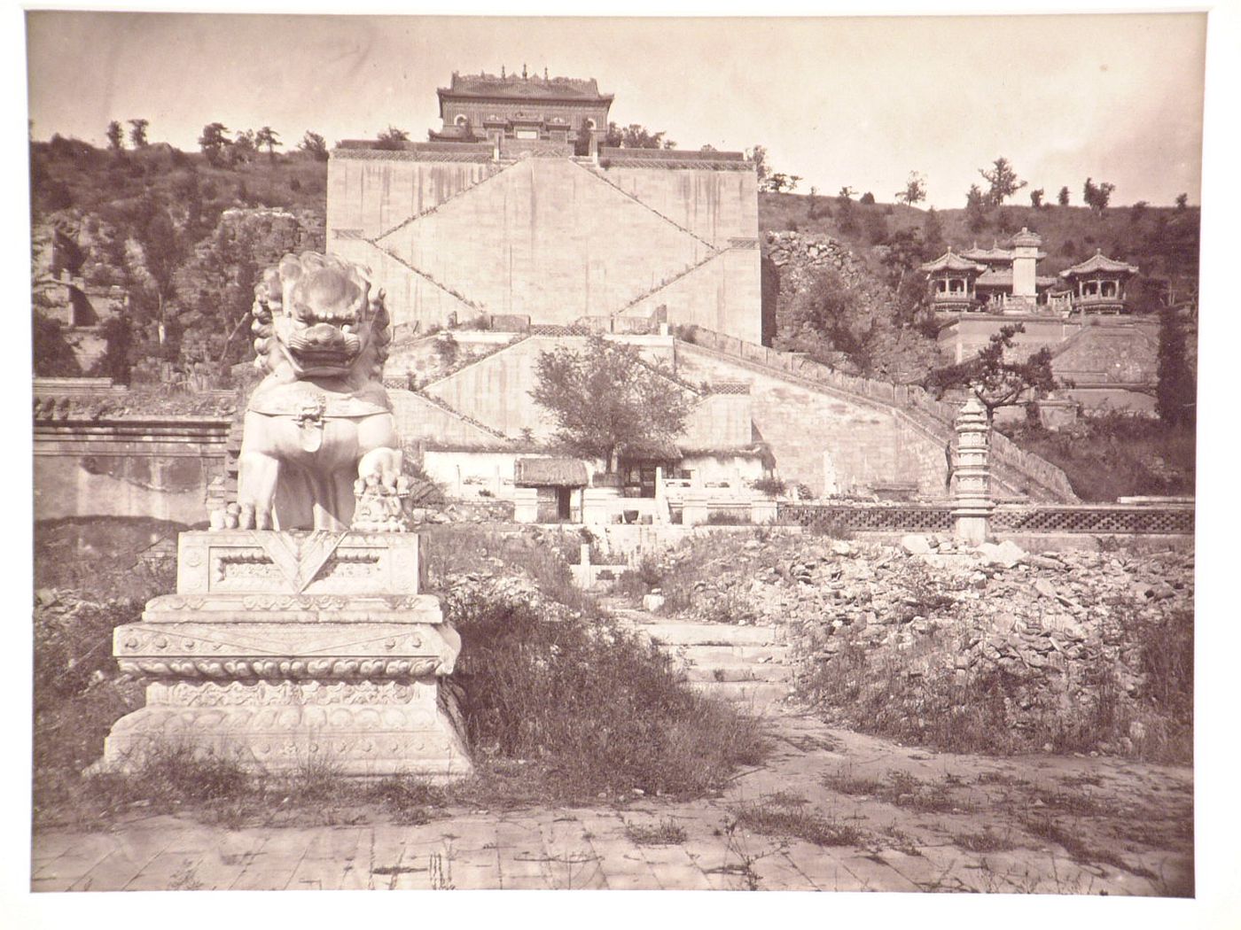 View of the Temple of the Sea of Wisdom [Zhihui Hai] and the Revolving Archive [Zhuanlun Cang], with a statue of a lion in the left foreground, Garden of the Clear Ripples [Qing Yi Yuan] (now the Summer Palace or Yihe Yuan), Peking (now Beijing), China