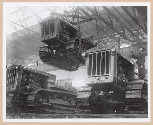Interior view of the Assembly [?] Building showing tractors, Soviet Diesel Tractor Assembly Plant, Cheliabinsk, Soviet Union (now in Russia)