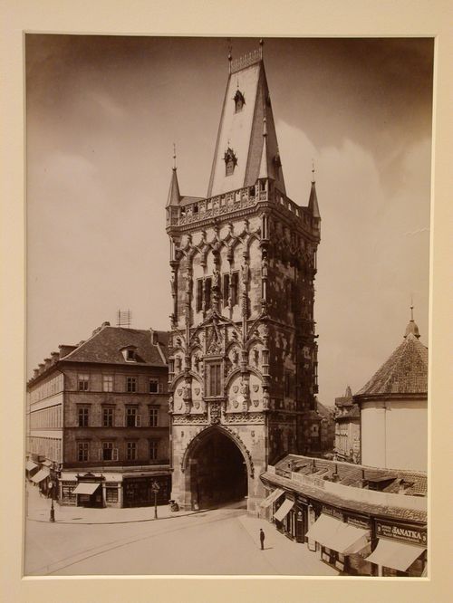 View of ornamented tower gate, houses and small shops, Prague, Czech Republic