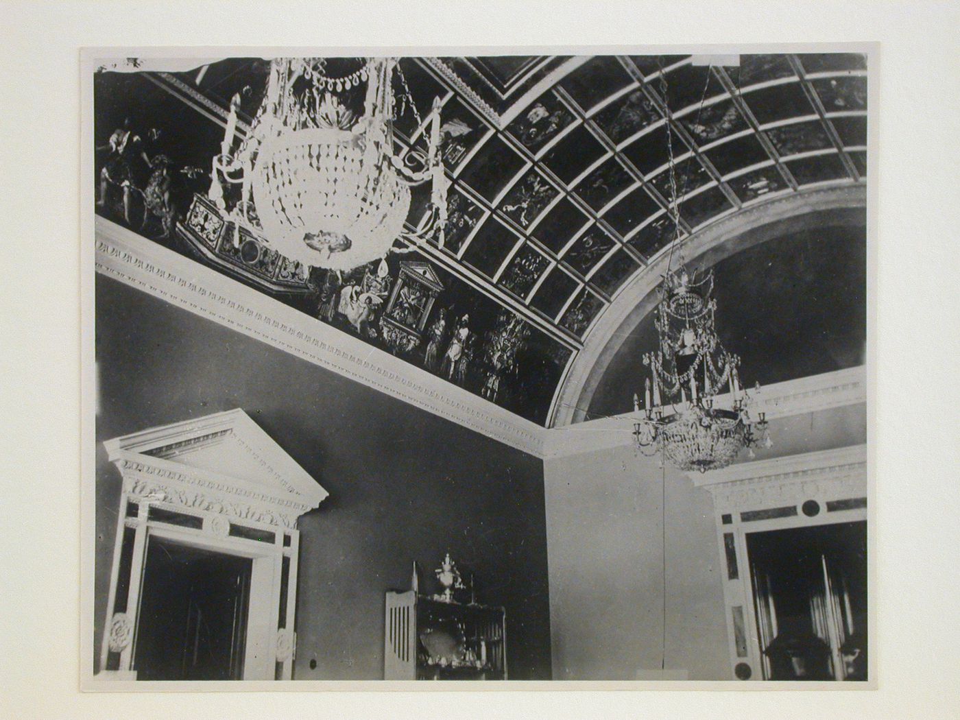 Interior view of the Tarasov Mansion showing a vaulted compartment ceiling with chandeliers and decorated doorframes, Moscow