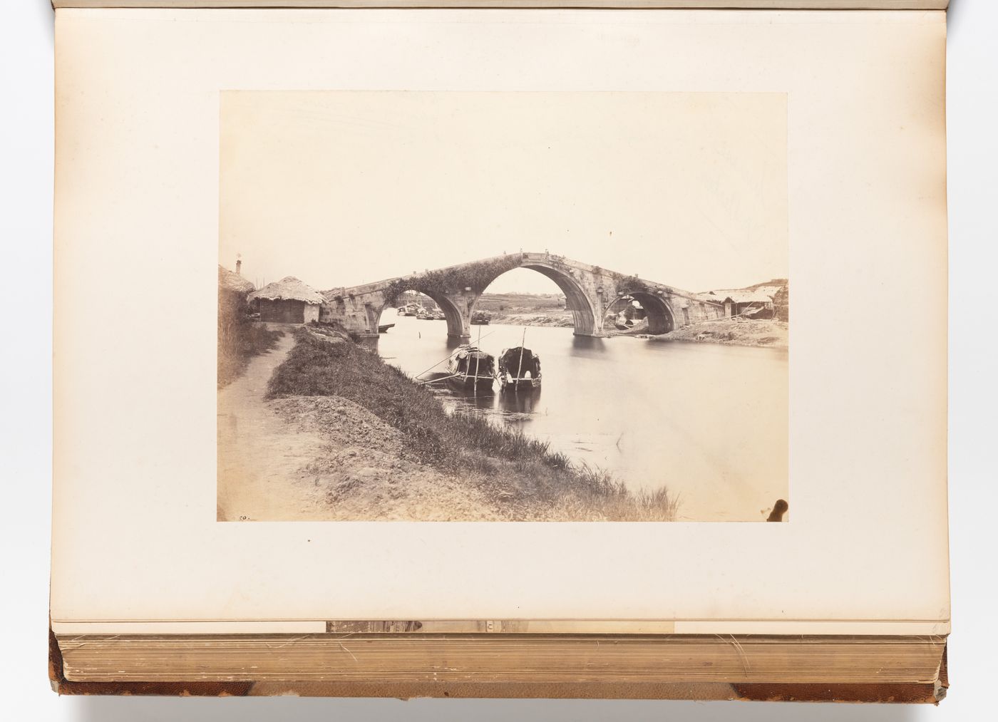 View of a stone arch bridge on the Wusong Jiang (also known as Suzhou Creek), Shanghai, China