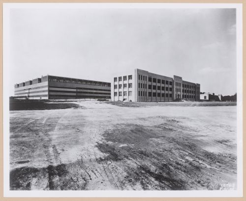 View of the principal and lateral façades of the [second] Assembly Building on the left and the Administration Building in the centre, both under construction, Glenn L. Martin Company Navy Assembly Plant No. 2, Middle River, Maryland