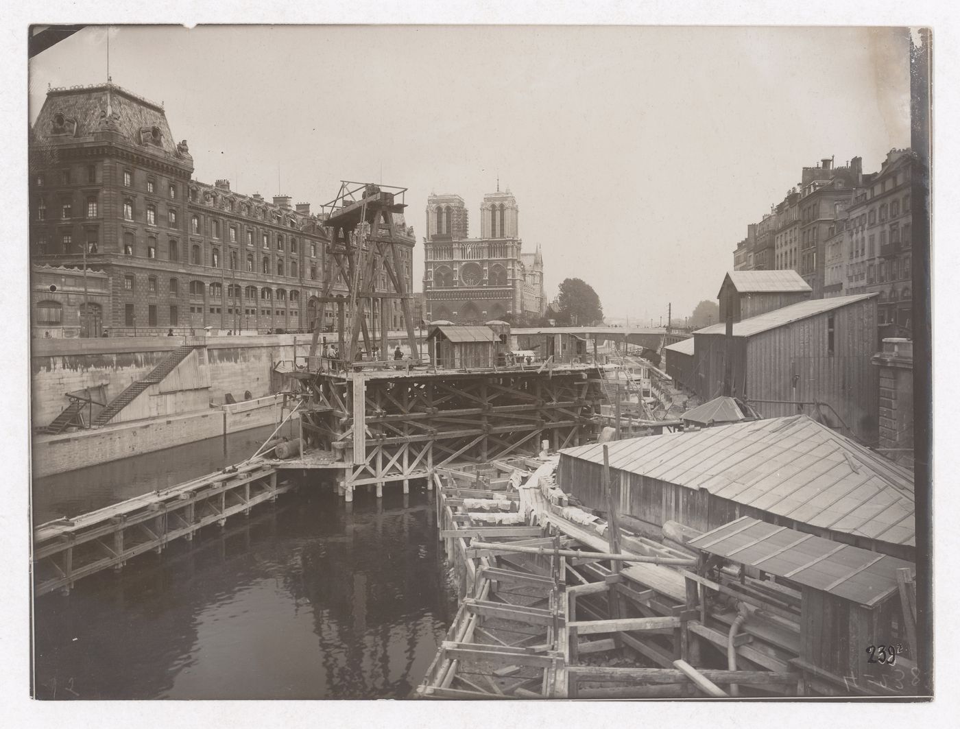 Construction of the Paris Metro, exterior view with the Seine and Notre Dame Cathedral in the background, Paris France