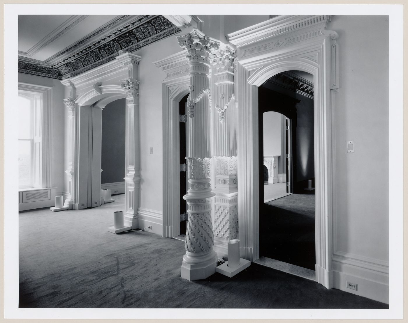 Interior view of the reception rooms showing doorways and a column, Shaughnessy House under renovation, Montréal, Québec