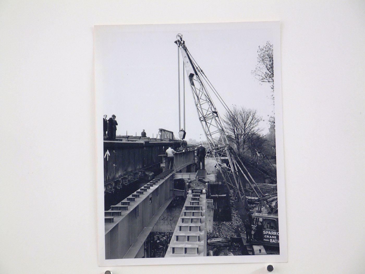 View of inner girder being lowered by crane, Bushey Bridge, England