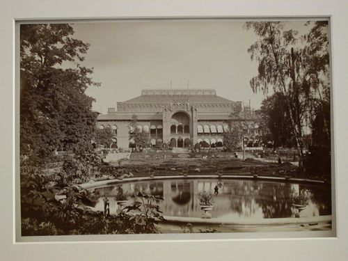 Façade of large building with glass skylights, in garden with large fountain, Berlin, Germany