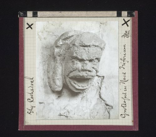 View of grotesque sculpture in triforium of nave of Ely Cathedral, Ely, Cambridgeshire, England