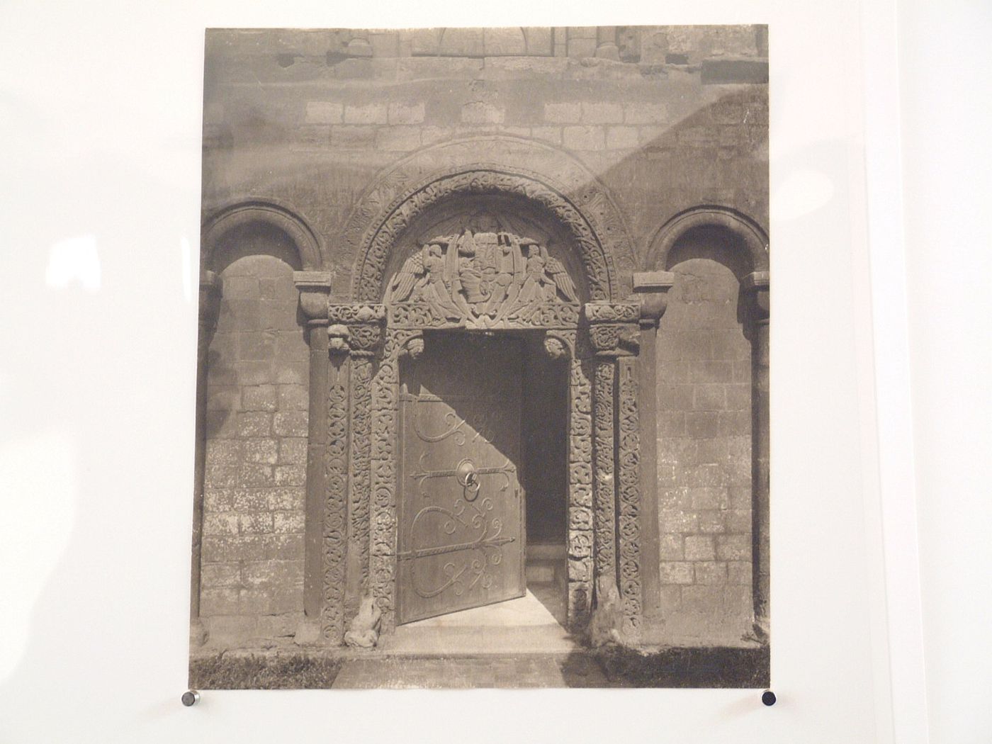 Detail of open door with sculpted tympanum, Ely Cathedral [?], Ely [?], England