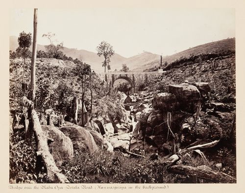 View of a bridge over the Maha Oya with Hunnasgiriya in the background, Dotala Road, Ceylon (now Sri Lanka)