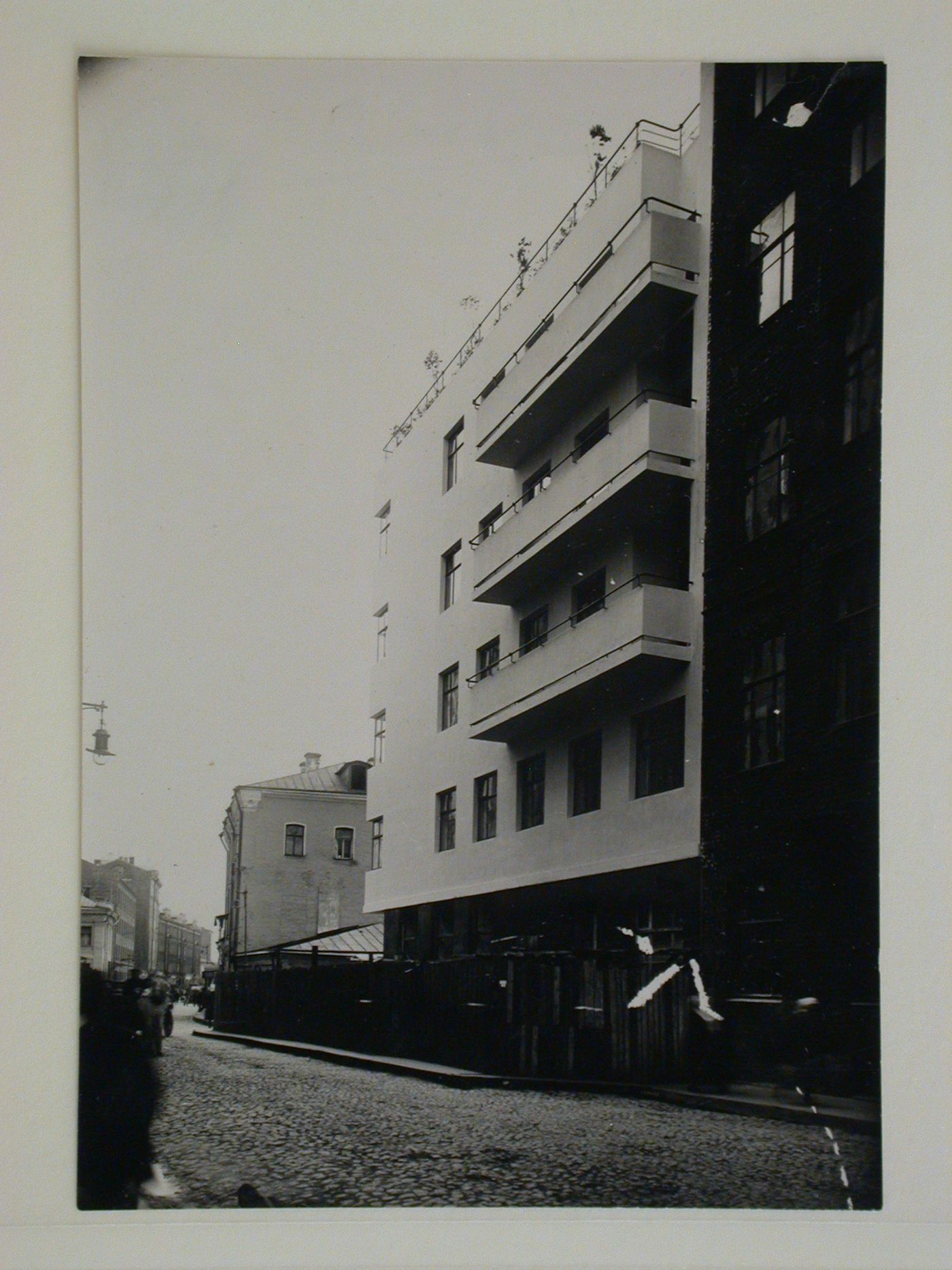 Exterior view of the house-commune for State Insurance (Gosstrakh) employees showing the ground floor boarded up, 21 Malaia Bronnaia Street, Moscow