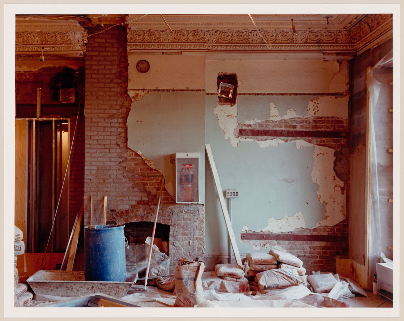 Interior view of a room showing a fireplace, Shaughnessy House under renovation, Montréal, Québec