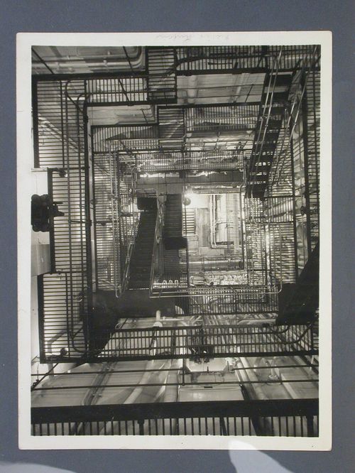Interior building view of pipe and grid-like catwalk system, Germany