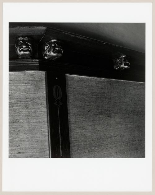 Close-up view of small sculpted grotesques on the plate rail of the sitting room/library of Slessor House, 1538 avenue Dr. Penfield, Montréal, Québec