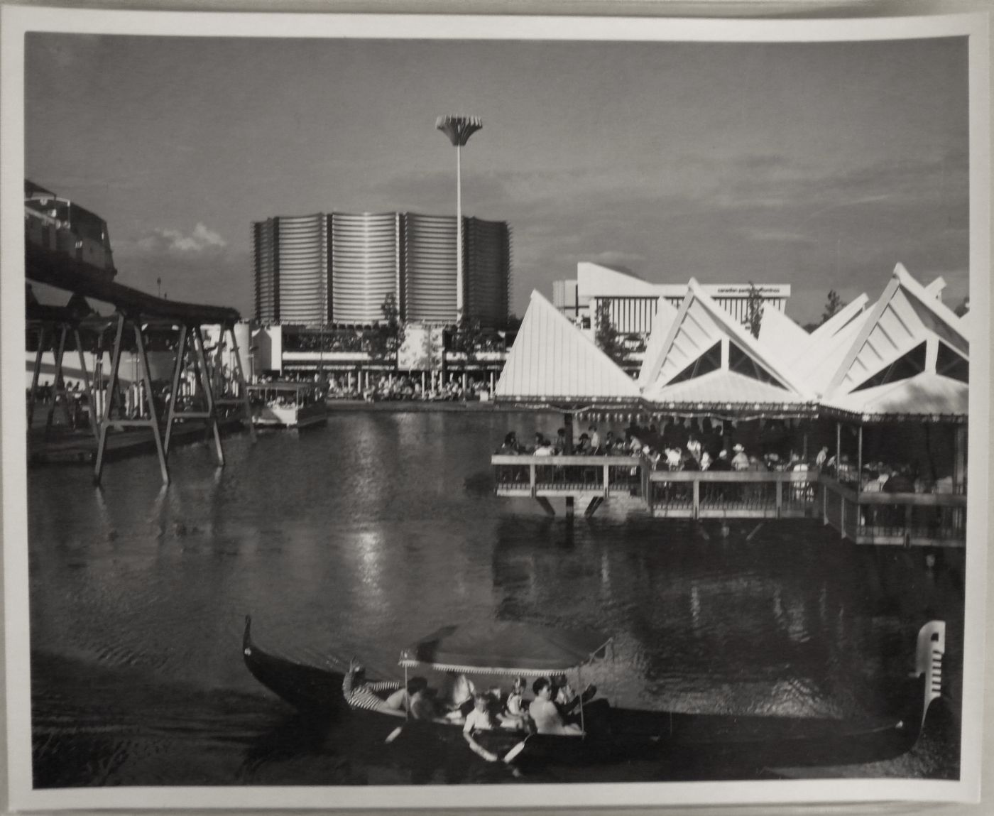 View on a waterway with a gondola in foreground and the Canadian Pacific-Cominco Pavilion in background, Expo 67, Montréal, Québec