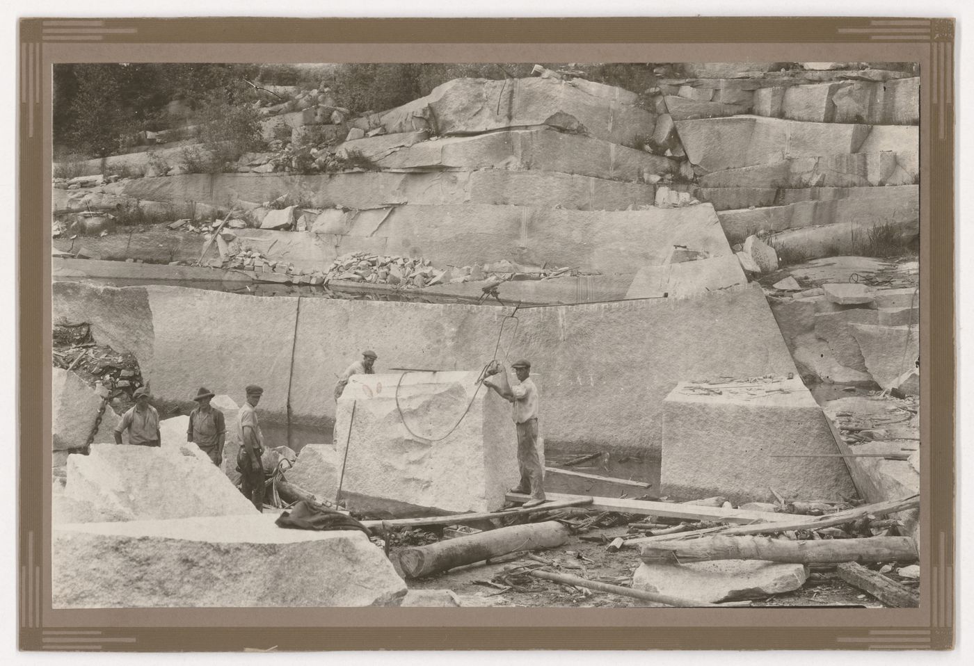 View of the Stanstead Granite Quarries with employees extracting stone for columns of the Palais de justice (now Édifice Ernest-Cormier), Beebe, Quebec, Canada