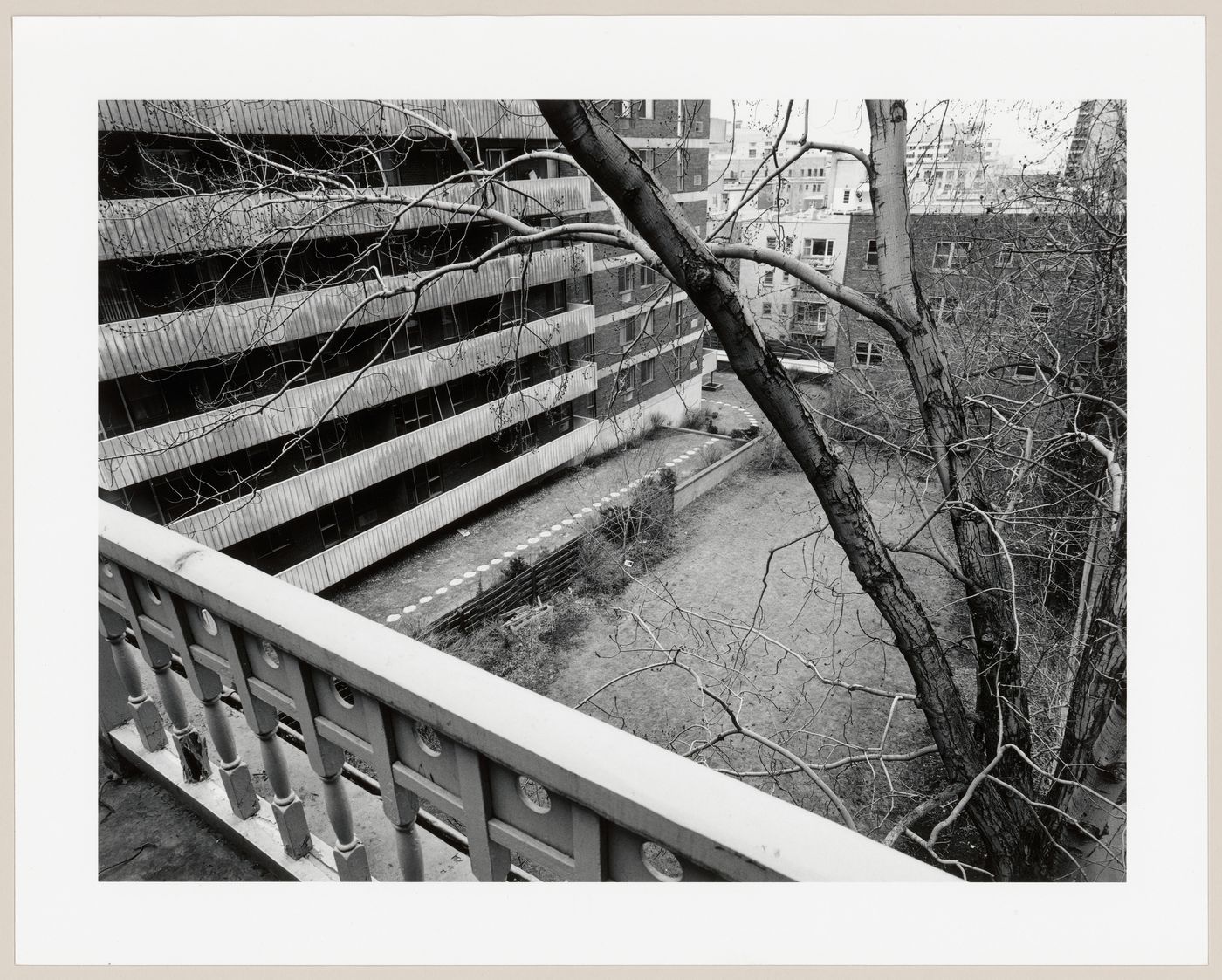 View from the second floor balcony of Slessor House showing the adjacent apartment buildings and the yard, 1538 avenue Dr. Penfield, Montréal, Québec
