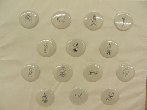 Pins, each depicting a different sketch by Cedric Price