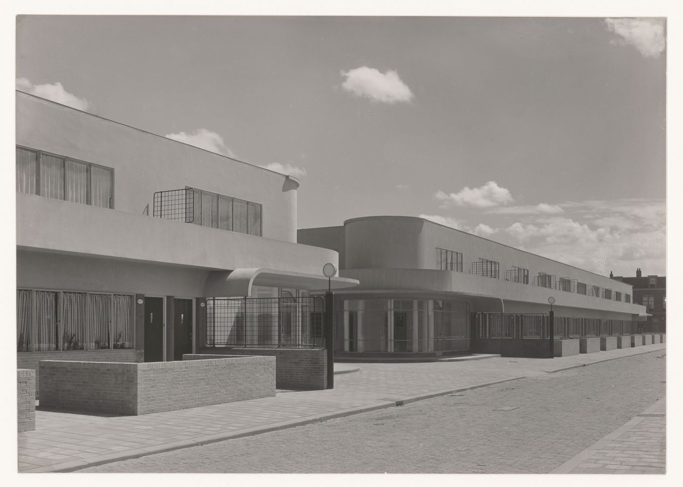 View of the principal façade of industrial row houses from the street, Hoek van Holland, Netherlands