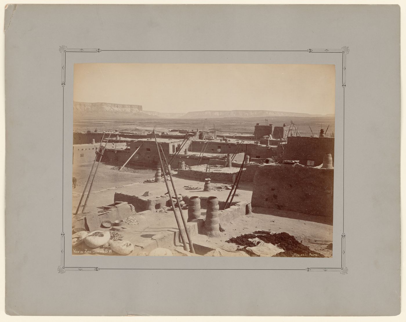 View of Zuni showing rooftop cooking areas with mesas in the background, New Mexico, United States