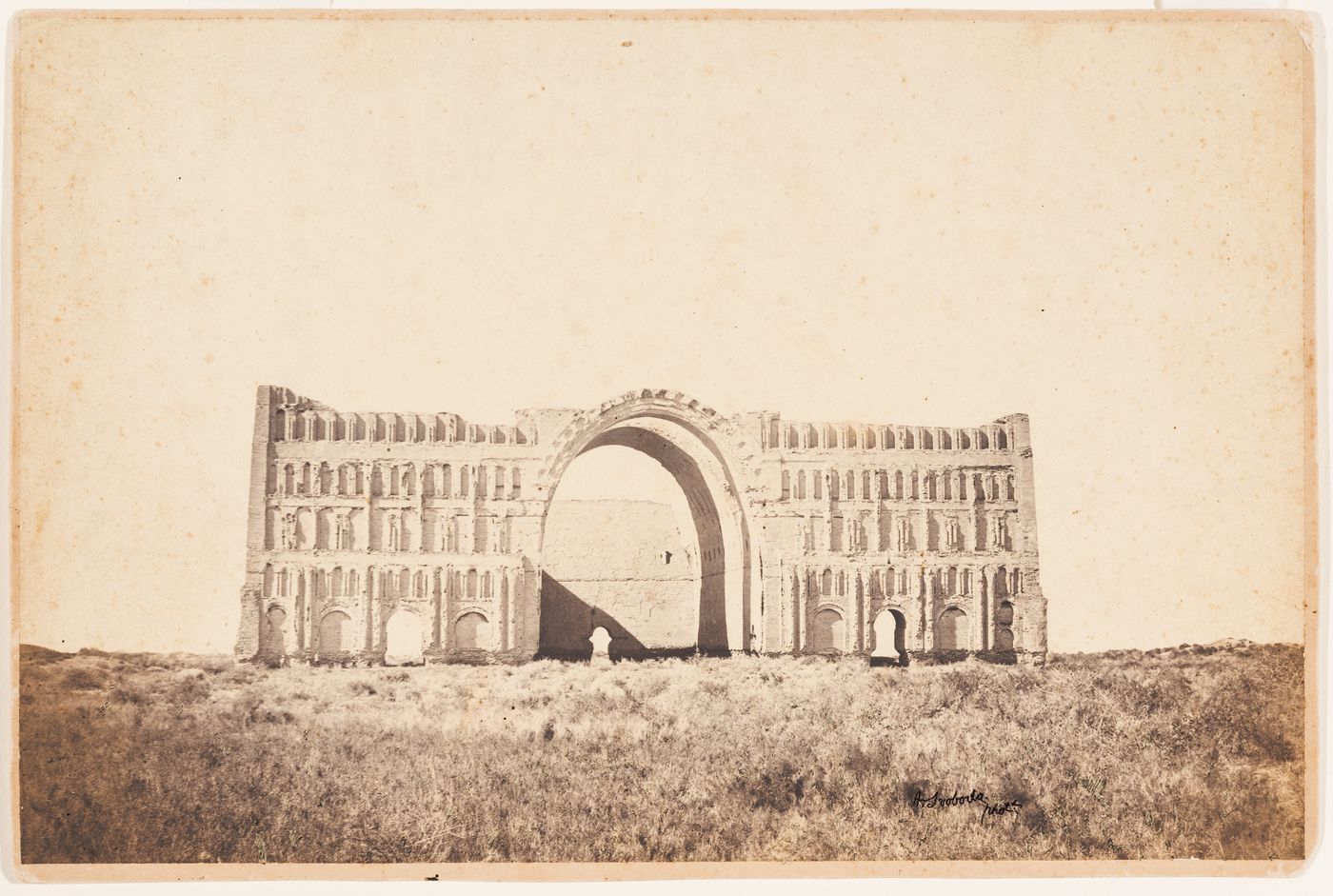 View of the principal façade of the Taq-i Kisra [Iwan of Khusraw] (also known as the Taq-i Khusrau, Iwan-i Kisra and Taq-e Kisra), Ctesiphon (now Al Madain), Ottoman Empire (now in Iraq)