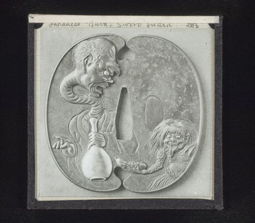 View of tsuba with fanciful carving, Japan