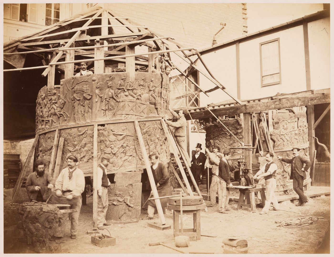 The Vendôme Column under reconstruction being assembled by workmen, Paris, France