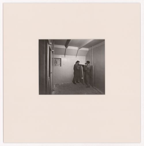 View of two men constructing an ocean liner cabin for the Otua, Salon d'automne, Paris, France