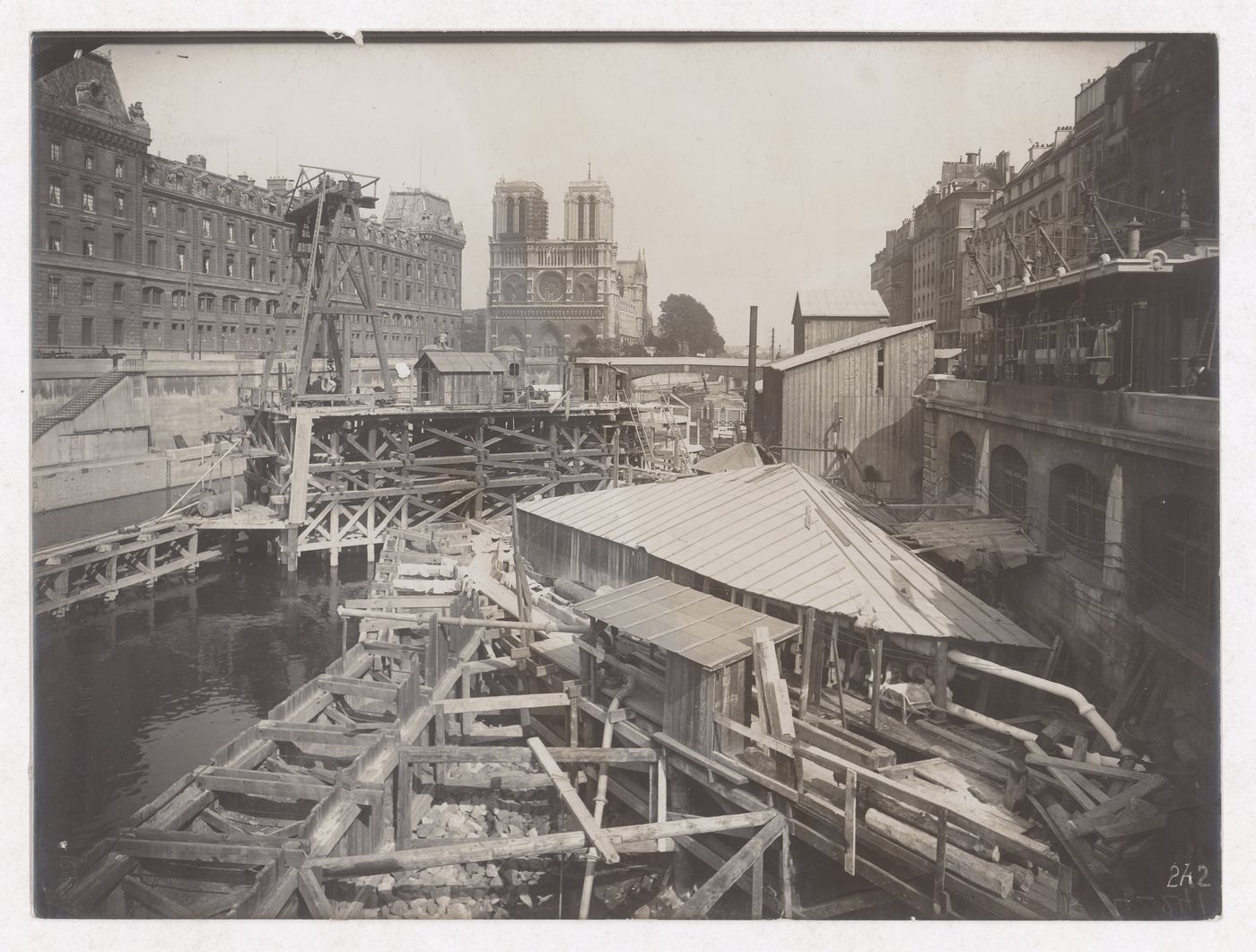 Construction of the Paris Metro, exterior view with the Seine and Notre Dame Cathedral in the background, Paris, France