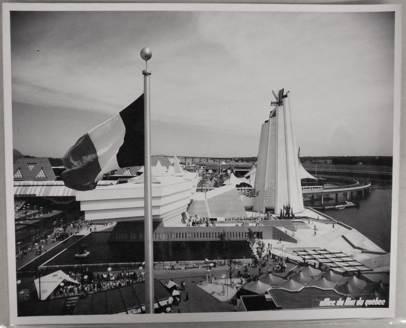 View of the Great Britain Pavilion with the French flag in foreground, Expo 67, Montréal, Québec