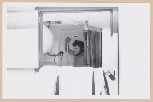 Arthur Acheson taking a shower in the Ecol House bathroom