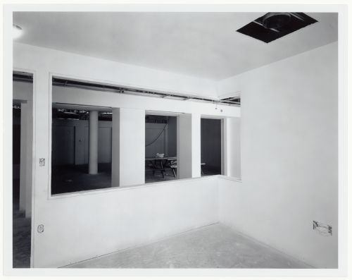Interior view of an office showing wall openings prior to the installation of interior windows, Canadian Centre for Architecture under construction, Montréal, Québec