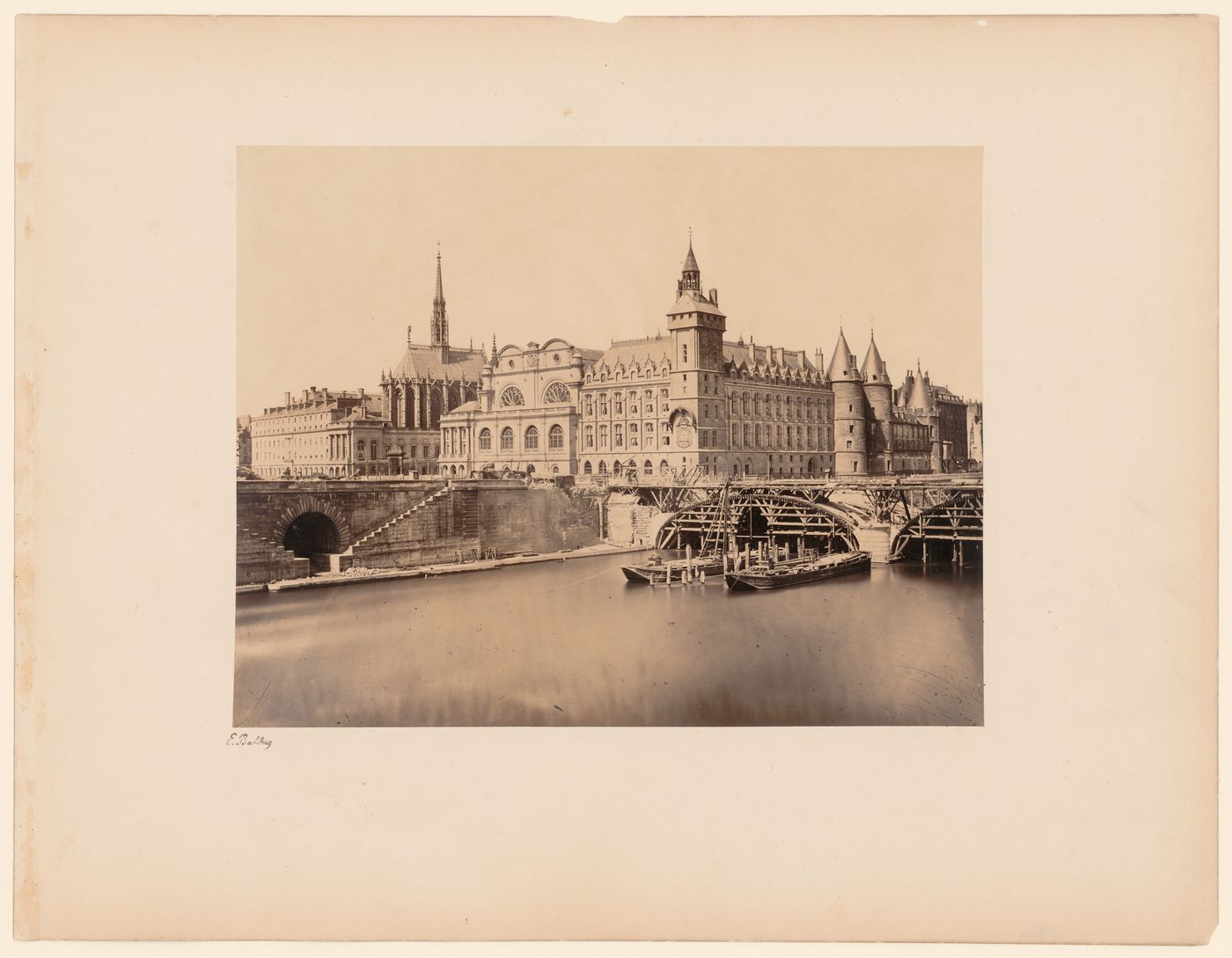 View of Ste. Chapelle, Palais de Justice, and Conciergerie, with Pont au Change under construction in the foreground, Paris, France