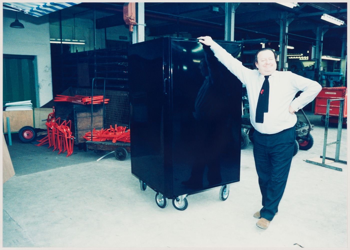 Westal: portrait of Cedric Price with prototype of a market stall