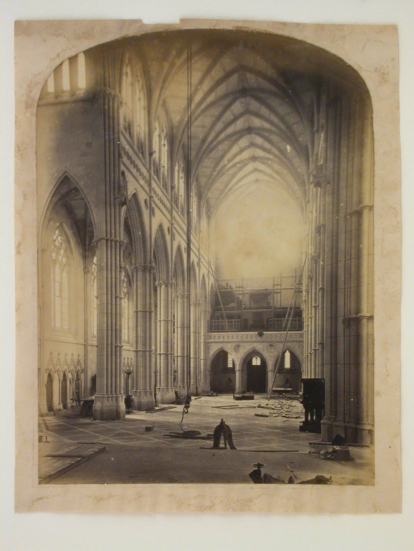 Interior view of the Church of St. Philip Neri (now the Cathedral of Our Lady and St. Philip Howard) under construction, looking from the apse down the nave, Arundel, West Sussex, England