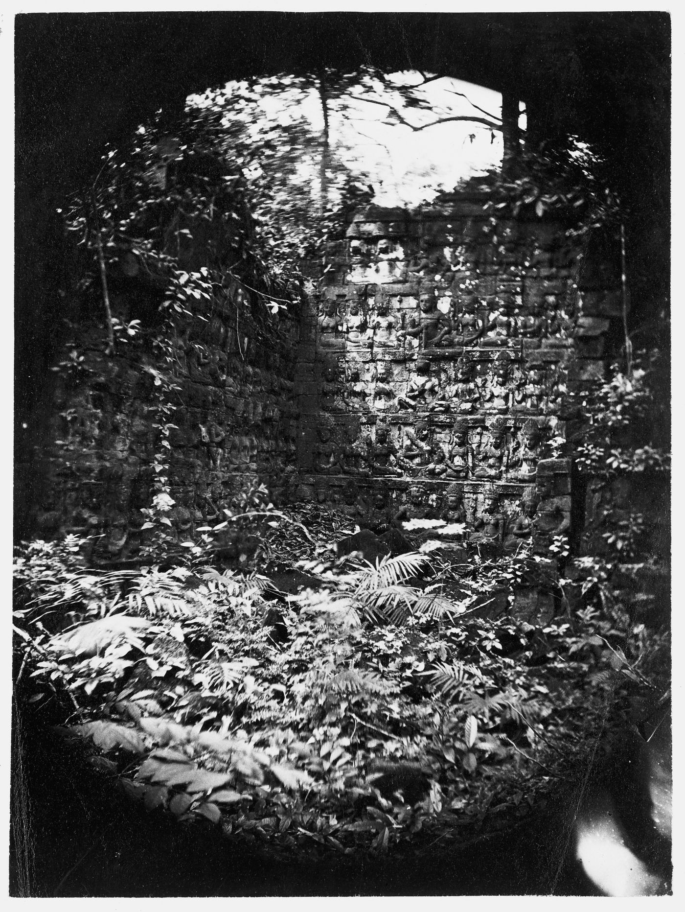 View of the terrace of the Leper King showing bas-reliefs, Angkor Thom, Siam (now in Cambodia)