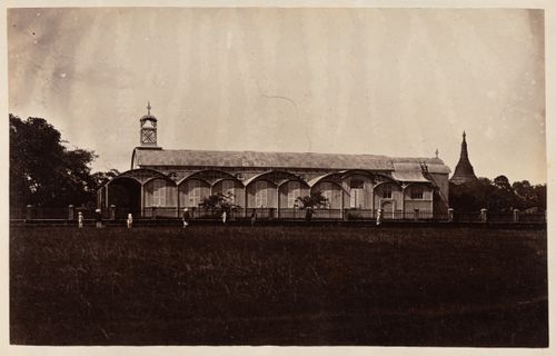 View of the Iron Church [?] with the Shwedagon Pagoda in the background, Rangoon (now Yangon), Burma (now Myanmar)