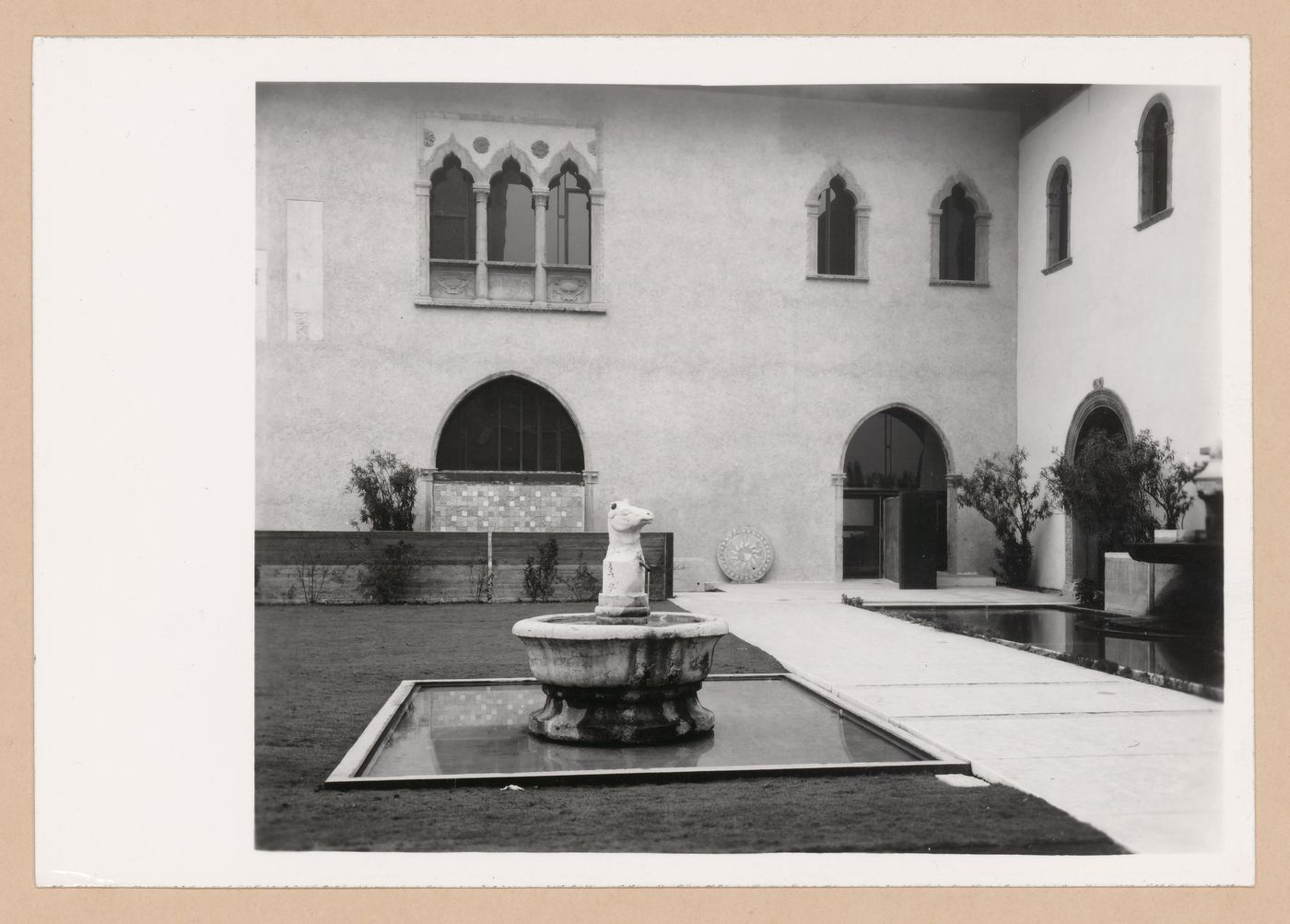 Partial view of the courtyard showing pools and a path, Museo di Castelvecchio, Verona, Italy
