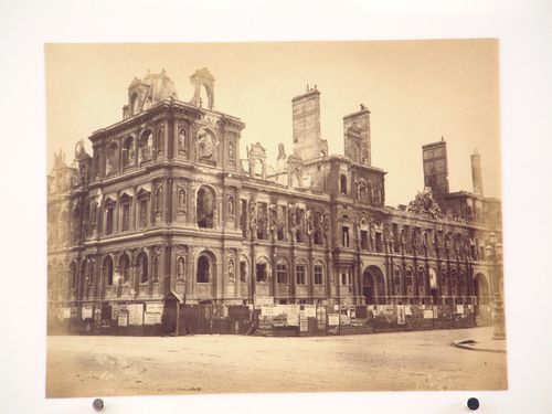 Partial view of the Hôtel de ville showing a soldier in the foreground after the Paris Commune uprising of 1871, corner of rue de Rivoli and Place Hôtel de ville, Paris, France