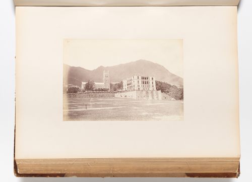 View of St. John's Cathedral and the premises of Augustine Heard & Co. showing the Parade Ground (also known as the Murray Parade Ground) in the foreground, Hong Kong (now Hong Kong, China)