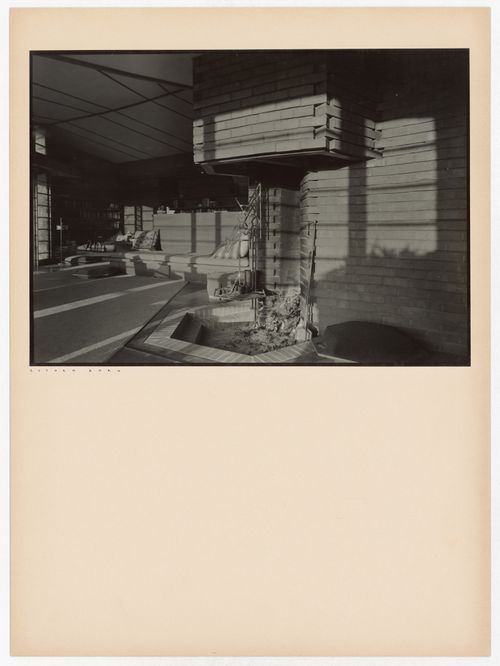 Interior view of the Hanna House showing a fireplace, a fireset, and seating furniture, Palo Alto, California, United States