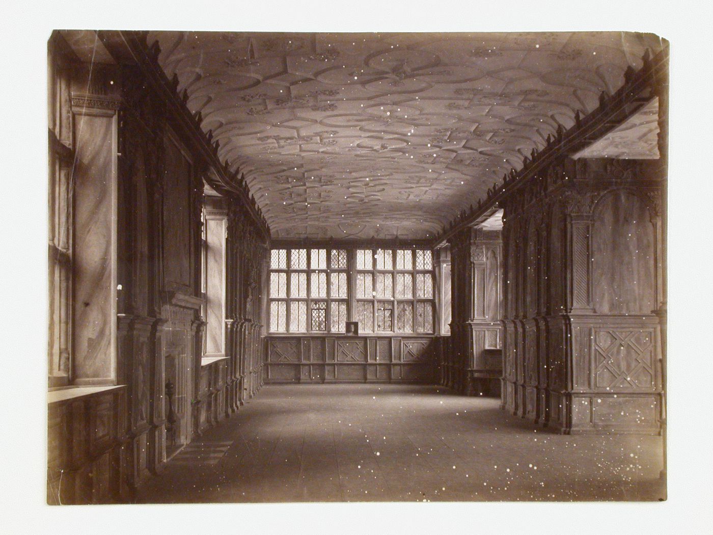 Interior view of the Long Gallery showing the death mask of Lady Grace Manners on the window ledge in the distance, Haddon Hall, Derbyshire, England