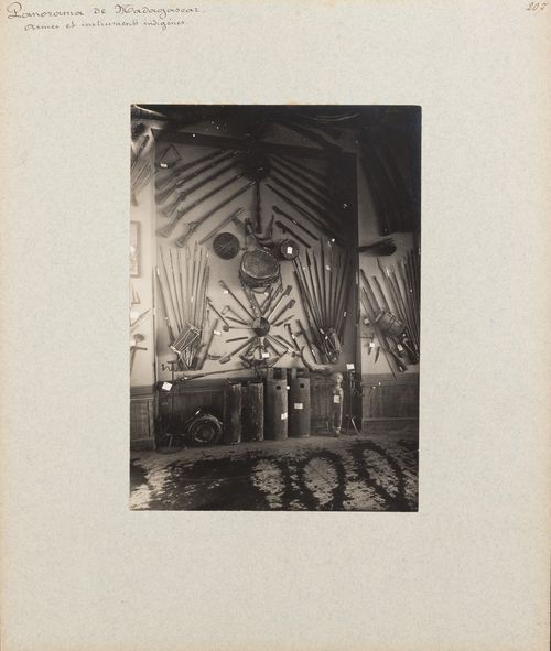 View of exhibition of rifles, spears, drums and other objects at Pavillon de Madagascar, Exposition universelle, 1900, Paris, France