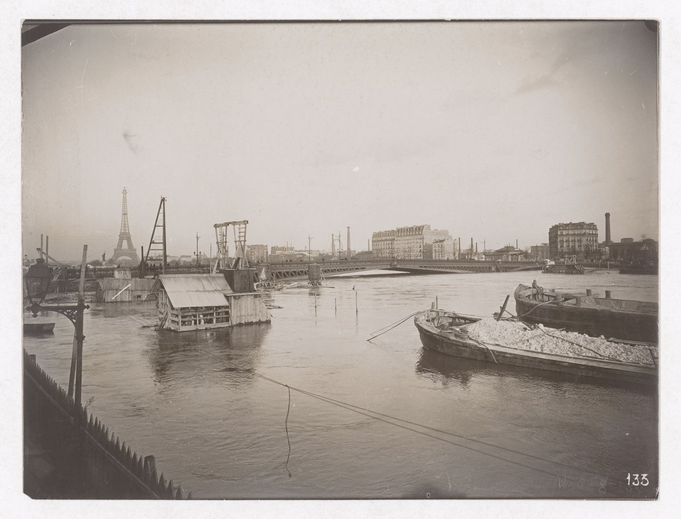 Construction of the Paris Metro, exterior view from the water with the Eiffel tower in the background, Paris, France