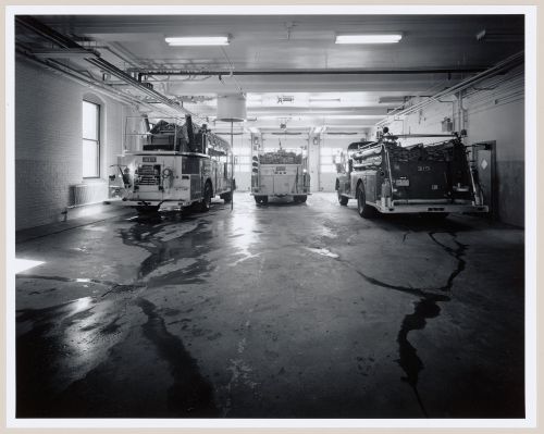Interior view of the main floor of Fire Station no. 15 showing firetrucks, Richmond Street, Montréal, Québec
