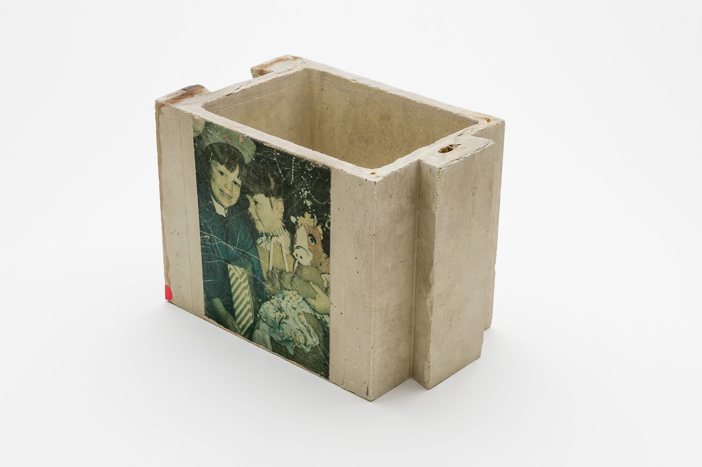 Green hollow sulphur concrete brick with the portrait a woman