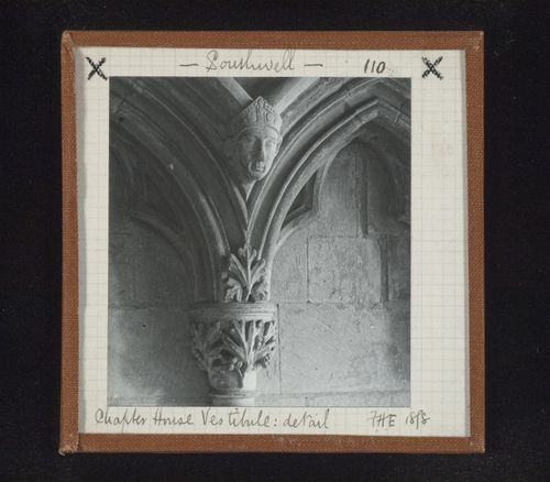 Detail view of blind arcade with capital and sculpture of head in vestibule of Chapter House, Southwell Minster, Southwell, Nottinghamshire, England